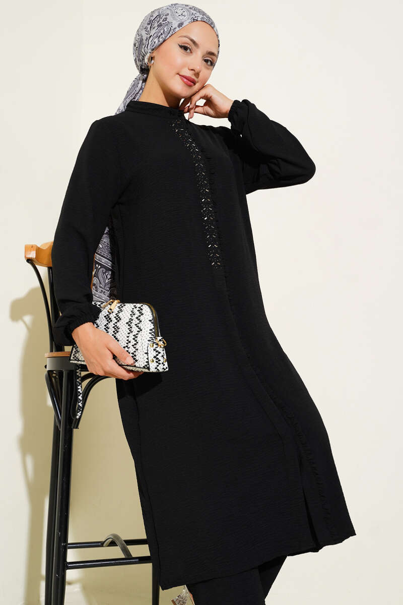 Black Two-piece set with ruffled front and silver stone detail.